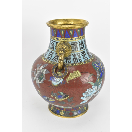 19 - A Chinese cloisonne archaic style 'flower' baluster vase, early 20th century, with twin brass mask h... 