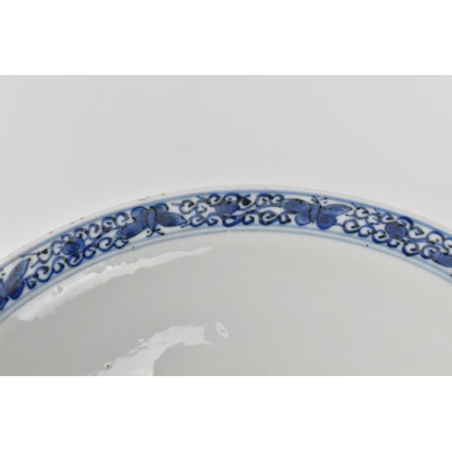 2 - A Chinese Qing dynasty blue and white porcelain bowl, 18th century, with butterfly and melon design ... 