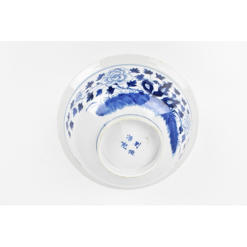 2 - A Chinese Qing dynasty blue and white porcelain bowl, 18th century, with butterfly and melon design ... 