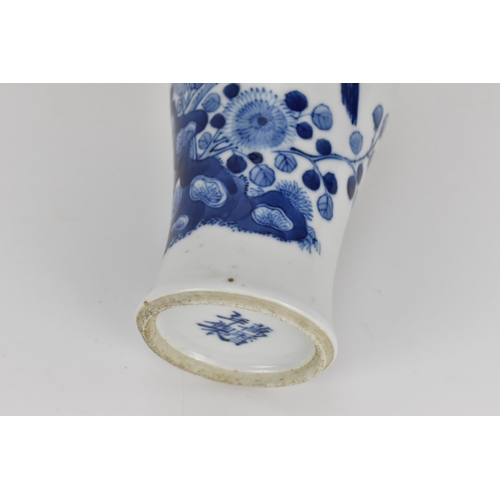 25 - A small Chinese blue and white porcelain baluster vase, 19th century, with birds in a blossoming pru... 