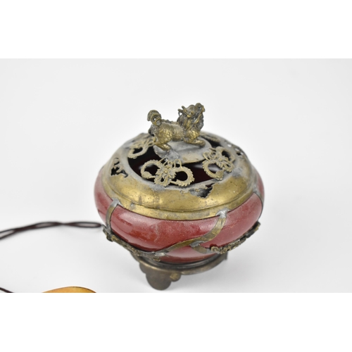 32 - A Japanese carved bone inro, together with a small sang de boeuf koro mounted with brass dragon and ... 