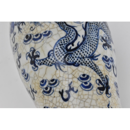 34 - A 19th century Chinese blue and white lidded baluster vase, with crackled glaze and bronze effect ba... 