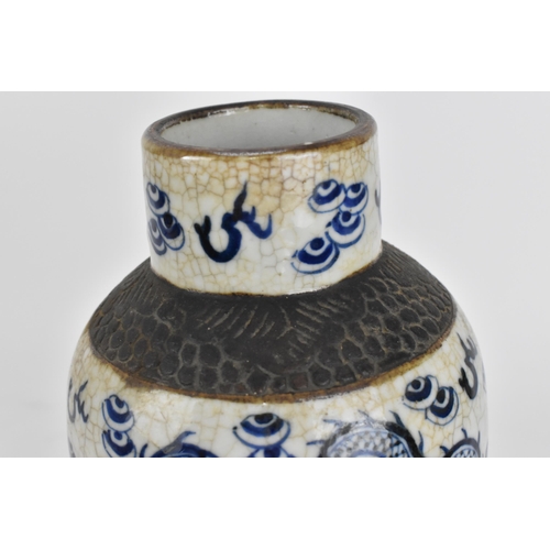 34 - A 19th century Chinese blue and white lidded baluster vase, with crackled glaze and bronze effect ba... 