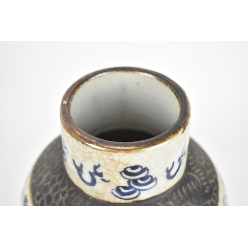 34 - A 19th century Chinese blue and white lidded baluster vase, with crackled glaze and bronze effect ba... 