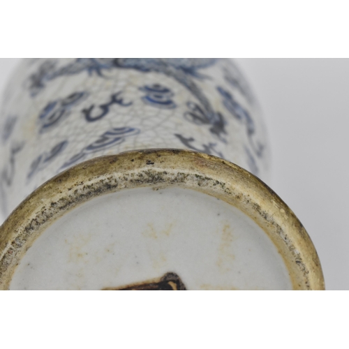 34 - A 19th century Chinese blue and white lidded baluster vase, with crackled glaze and bronze effect ba... 