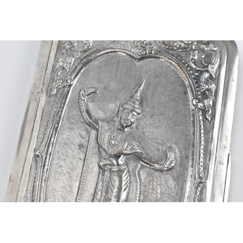 35 - An Indian white metal card case, of rectangular form with central dancing deity to the front on a te... 