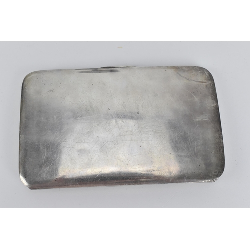 35 - An Indian white metal card case, of rectangular form with central dancing deity to the front on a te... 