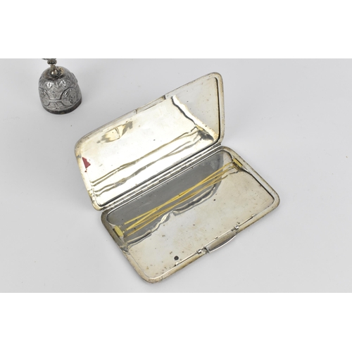 35 - An Indian white metal card case, of rectangular form with central dancing deity to the front on a te... 