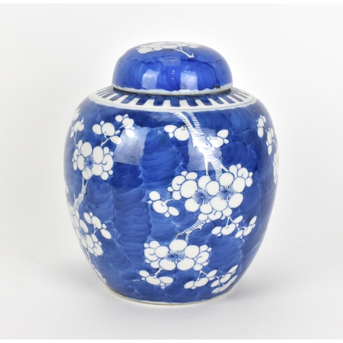 36 - A Chinese late Qing dynasty blue and white lidded ginger jar, late 19th century, of typical ovoid fo... 