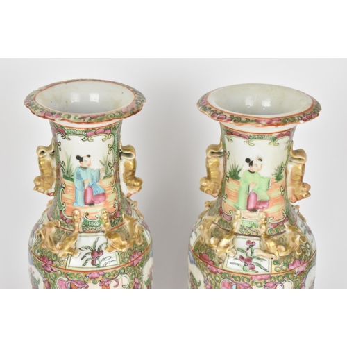 39 - A pair of Chinese export Famille Rose porcelain vases, 19th century, Canton, of baluster form with g... 