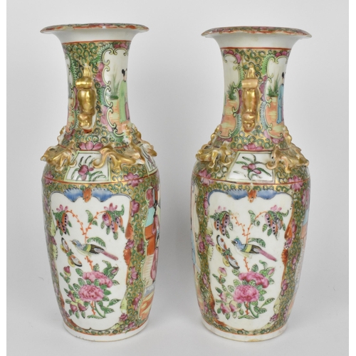 39 - A pair of Chinese export Famille Rose porcelain vases, 19th century, Canton, of baluster form with g... 