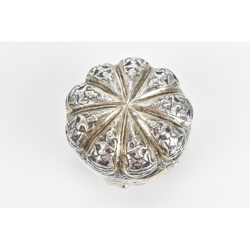 44 - An Indian colonial Swami white metal lidded pot, circa 1890/1900, Madras, of circular form with embo... 