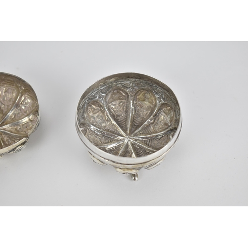 44 - An Indian colonial Swami white metal lidded pot, circa 1890/1900, Madras, of circular form with embo... 