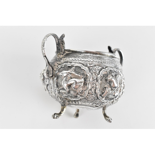 45 - An Indian colonial white metal twin-handled pot, possibly Bombay, circa 1890/1900, with deep embosse... 