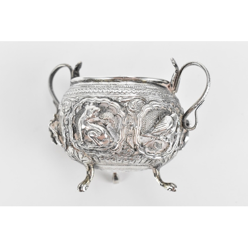 45 - An Indian colonial white metal twin-handled pot, possibly Bombay, circa 1890/1900, with deep embosse... 