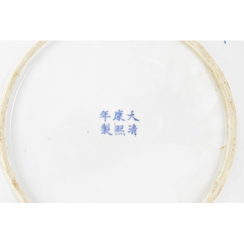 49 - A Chinese Qing dynasty blue and white charger, in the Kangxi style but 19th century, with central fi... 