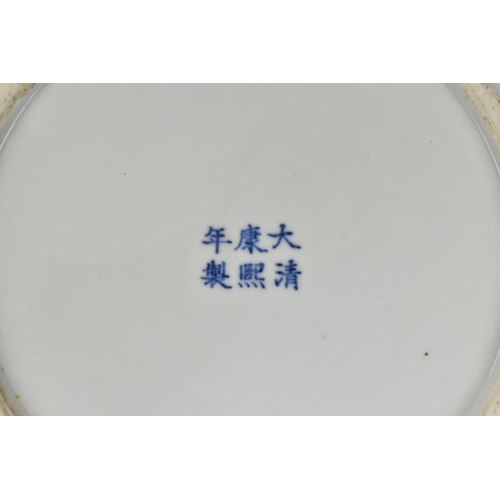 50 - A Chinese Qing dynasty blue and white charger, in the Kangxi style but 19th century, with central fi... 