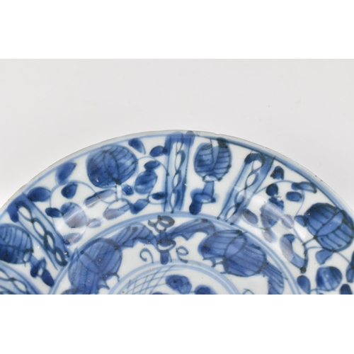 51 - A small Chinese Kangxi period blue and white dish, of circular form with foliate motif, the undersid... 