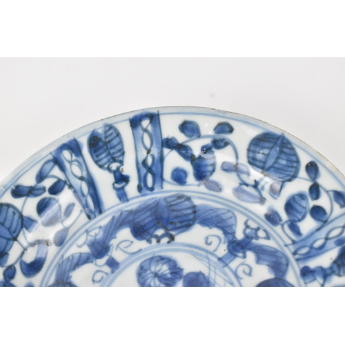 51 - A small Chinese Kangxi period blue and white dish, of circular form with foliate motif, the undersid... 