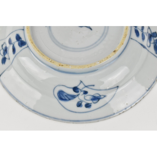 51 - A small Chinese Kangxi period blue and white dish, of circular form with foliate motif, the undersid... 