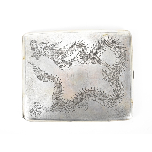 56 - A Chinese export silver cigarette case, circa 1900, with engraved dragon to the top on a stippled gr... 