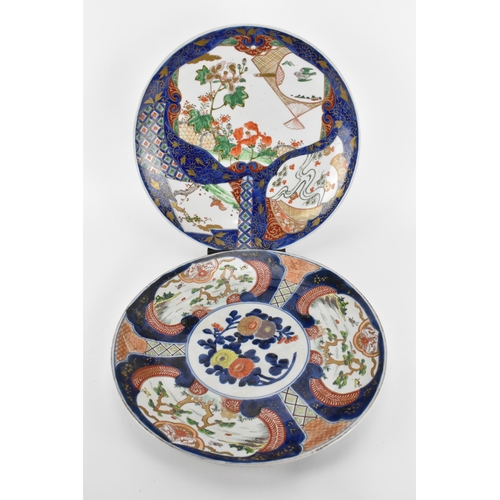 57 - Two Japanese arita porcelain chargers, late Meiji period, with enamelled outdoor vignettes with gilt... 