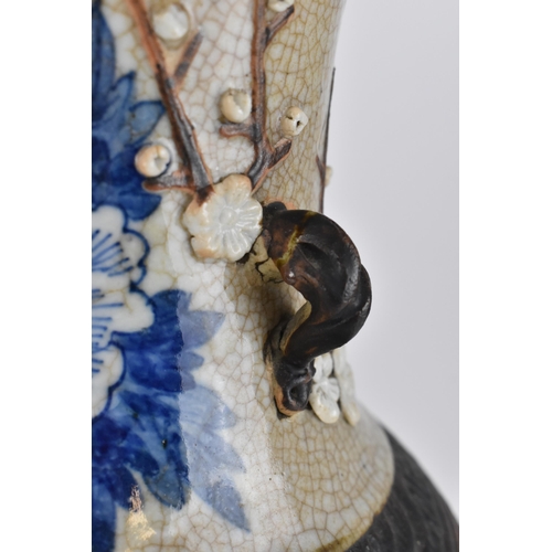 58 - A 19th century Chinese blue and white baluster vase, with crackled glaze and bronze effect banding, ... 