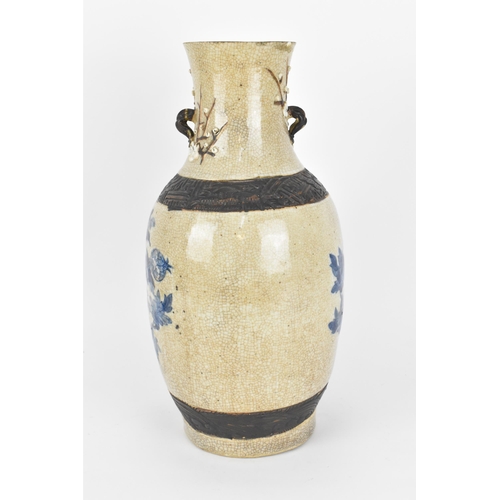 58 - A 19th century Chinese blue and white baluster vase, with crackled glaze and bronze effect banding, ... 