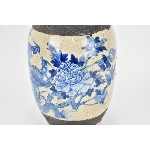 58 - A 19th century Chinese blue and white baluster vase, with crackled glaze and bronze effect banding, ... 