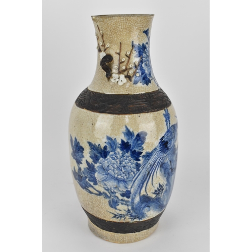 58 - A 19th century Chinese blue and white baluster vase, with crackled glaze and bronze effect banding, ... 