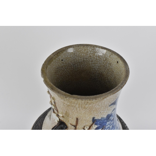 58 - A 19th century Chinese blue and white baluster vase, with crackled glaze and bronze effect banding, ... 