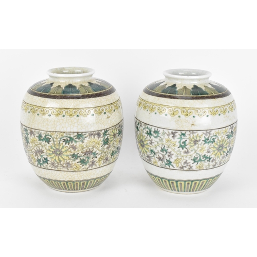 60 - A pair of Chinese Famille Verte ginger jars, decorated in the Kangxi style with leaf tip frieze to t... 