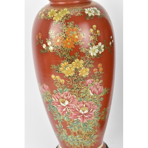 63 - A pair of Japanese Taisho period vases, possibly Satsuma, painted with floral blooms with fine gilt ... 