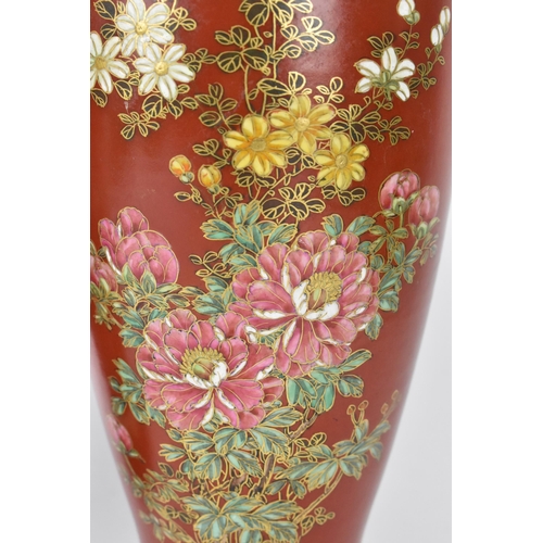 63 - A pair of Japanese Taisho period vases, possibly Satsuma, painted with floral blooms with fine gilt ... 