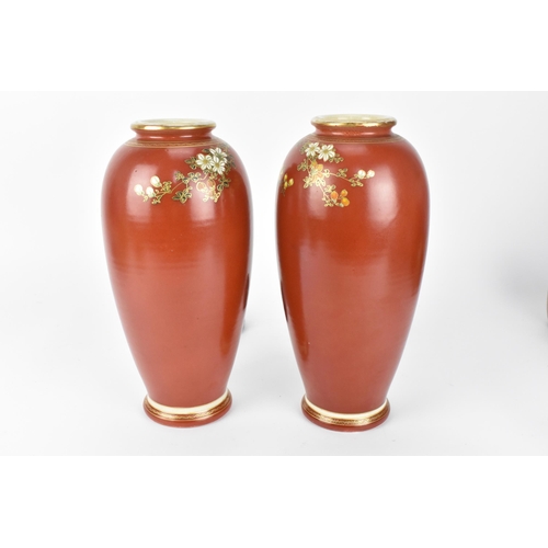 63 - A pair of Japanese Taisho period vases, possibly Satsuma, painted with floral blooms with fine gilt ... 