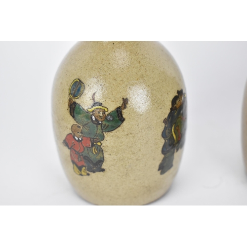 65 - A small collection of Chinese ceramics, comprising a pair of crackle glazed bottle vases with figura... 