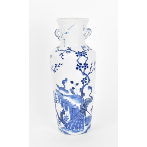 8 - A Chinese Qing dynasty blue and white porcelain vase, late 19th century, of tapered form with peacoc... 