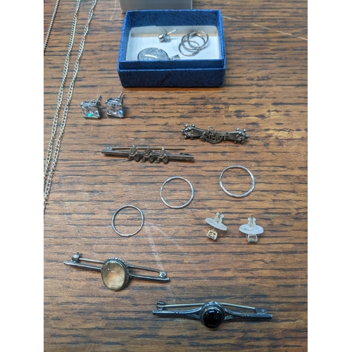 102 - Jewellery to include an Irish brooch, a Victorian silver brooch, a tigers eye pendant, silver chain,... 