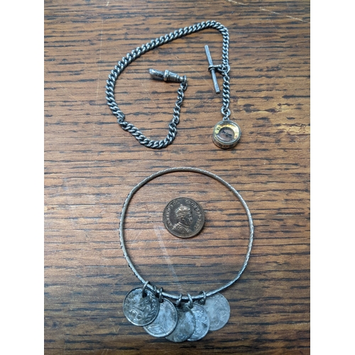 104 - A silver watch chain with a silver collar compass, a coin brooch and bracelet
Location:CAB3