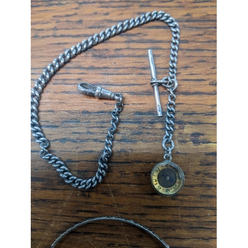 104 - A silver watch chain with a silver collar compass, a coin brooch and bracelet
Location:CAB3