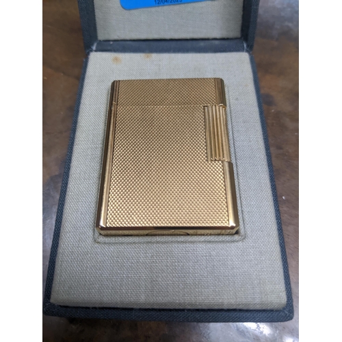 113 - A cased gold plated Dupont Paris cigarette lighter serial number BK2968 Location:CAB5