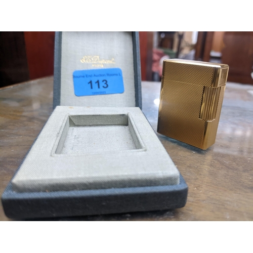 113 - A cased gold plated Dupont Paris cigarette lighter serial number BK2968 Location:CAB5