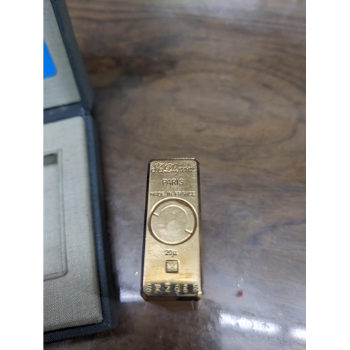 113 - A cased gold plated Dupont Paris cigarette lighter serial number BK2968 Location:CAB5