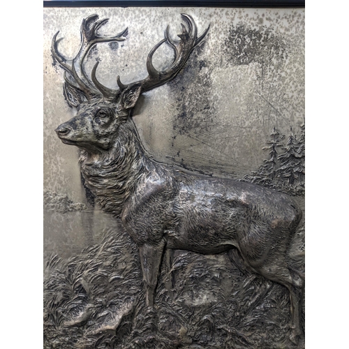 114 - Fritz Diller (1875-1945) - a silver plated relief plaque depicting a stag in a landscape with trees ... 