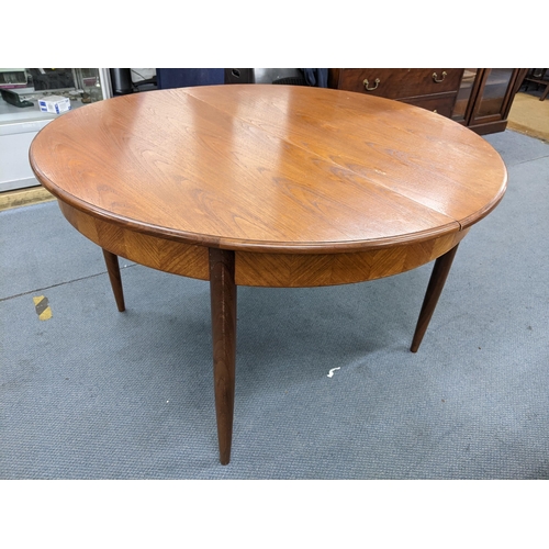 18 - A mid 20th century retro G-Plan teak Fresco extending dining table designed by Victor Wilkins, 73.5h... 