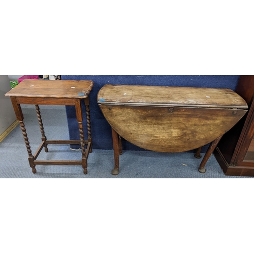 27 - A Georgian mahogany gateleg table 69.5cm h x 109.5cm w, together with a 1930s oak barley twist occas... 