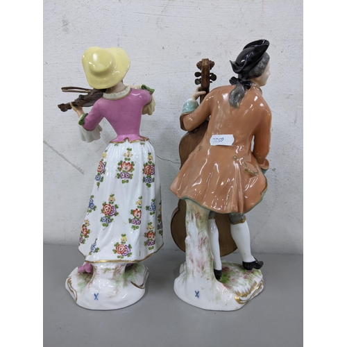 29 - Two 19th century continental porcelain figures of a lady playing the violin and man playing the cell... 