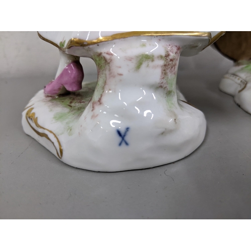 29 - Two 19th century continental porcelain figures of a lady playing the violin and man playing the cell... 