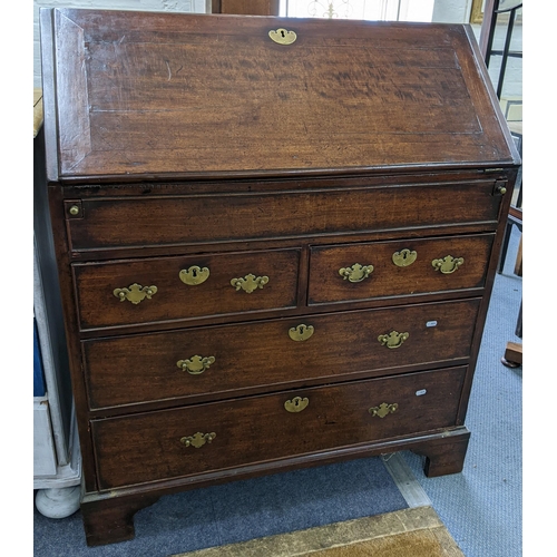 8 - A Georgian mahogany bureau having a fall flap opening to reveal pigeonholes and drawers, all above t... 