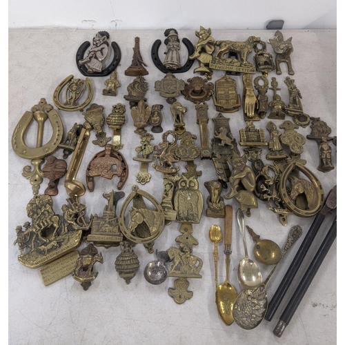 85 - Mixed metalware mostly brass door knockers to include door knockers in the form of gargoyles, one in... 